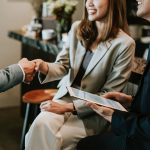 lady shaking hand with professional