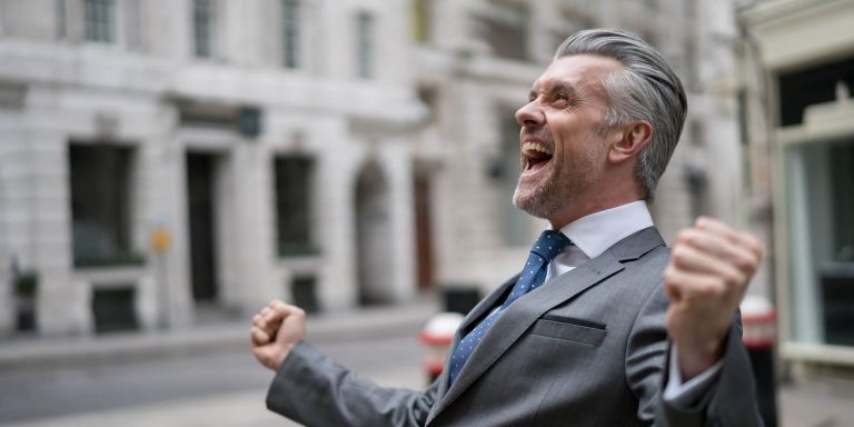 a happy man spreading hand in joy